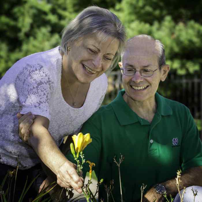 wilder foundation caregiving services, caregiver support group for dementia and memory loss, older adult couple picking flower, adult day care program