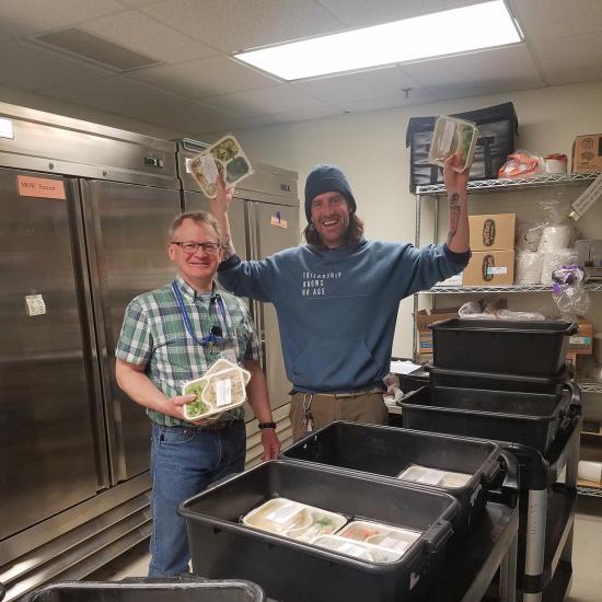 Wilder employee and volunteer pack frozen meals for Meals on Wheels customers