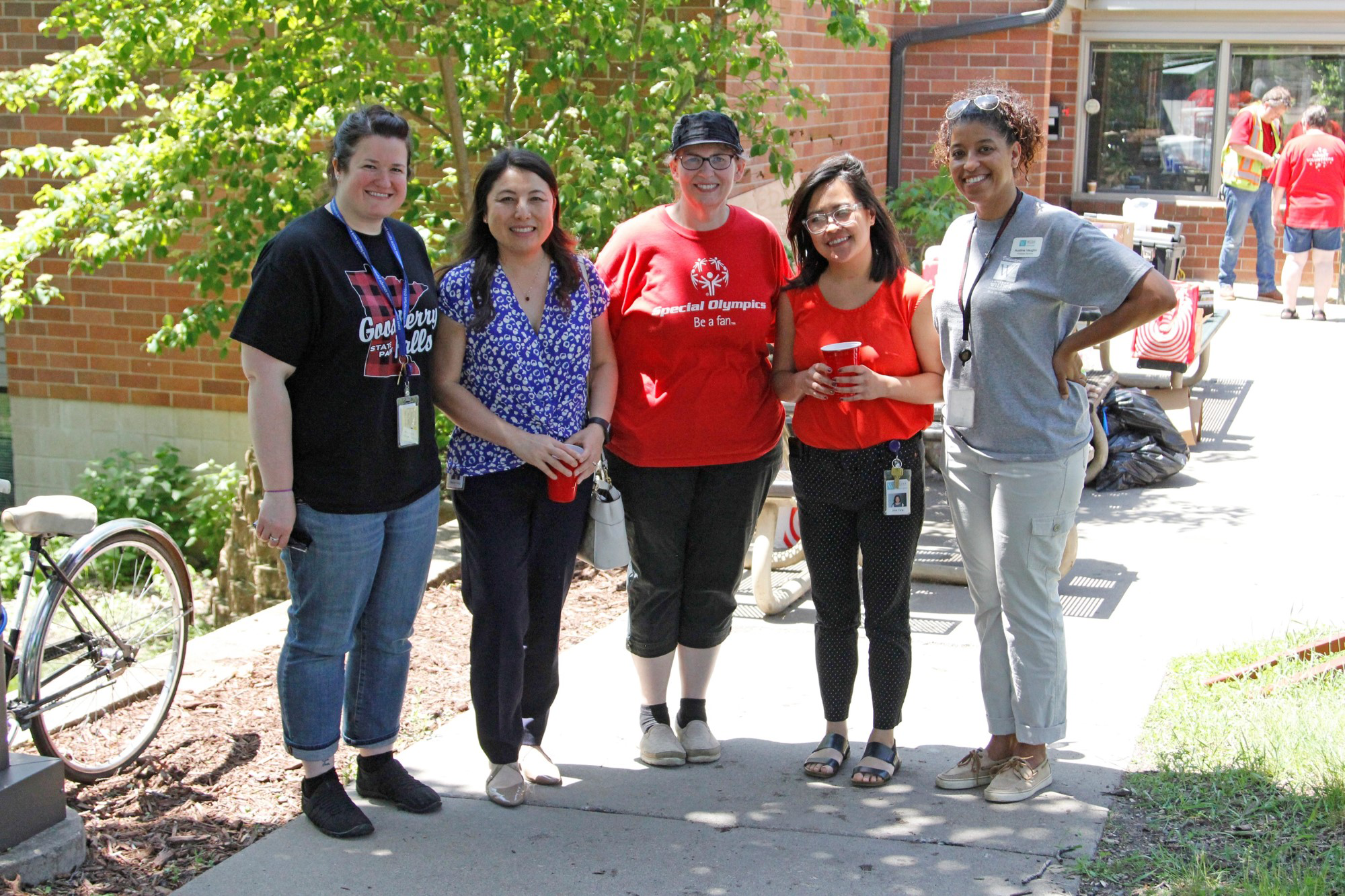 Five Wilder and Target staff pose outside the Wilder Center for Social Healing.