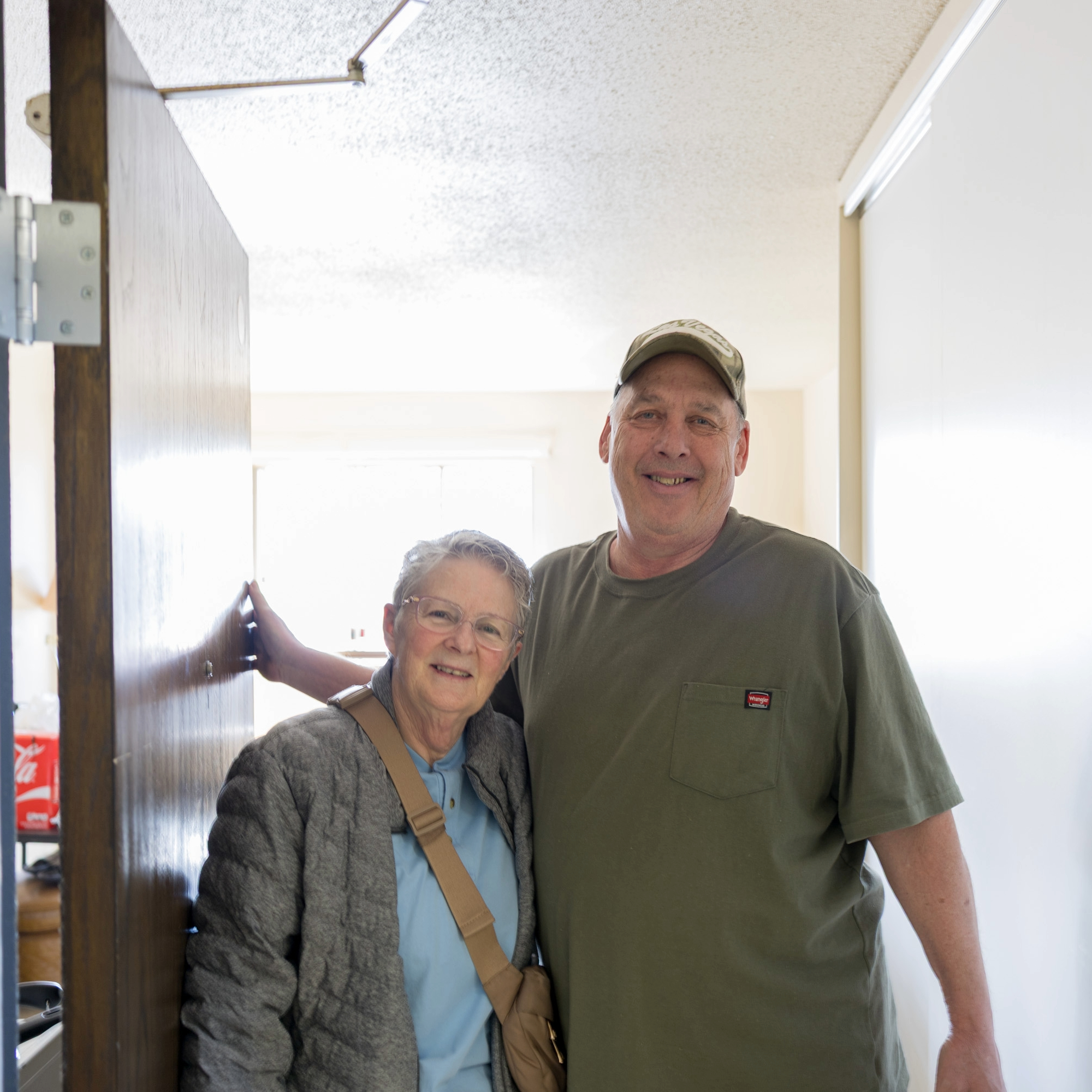 Meals on Wheels volunteer posing with client she delivered to.
