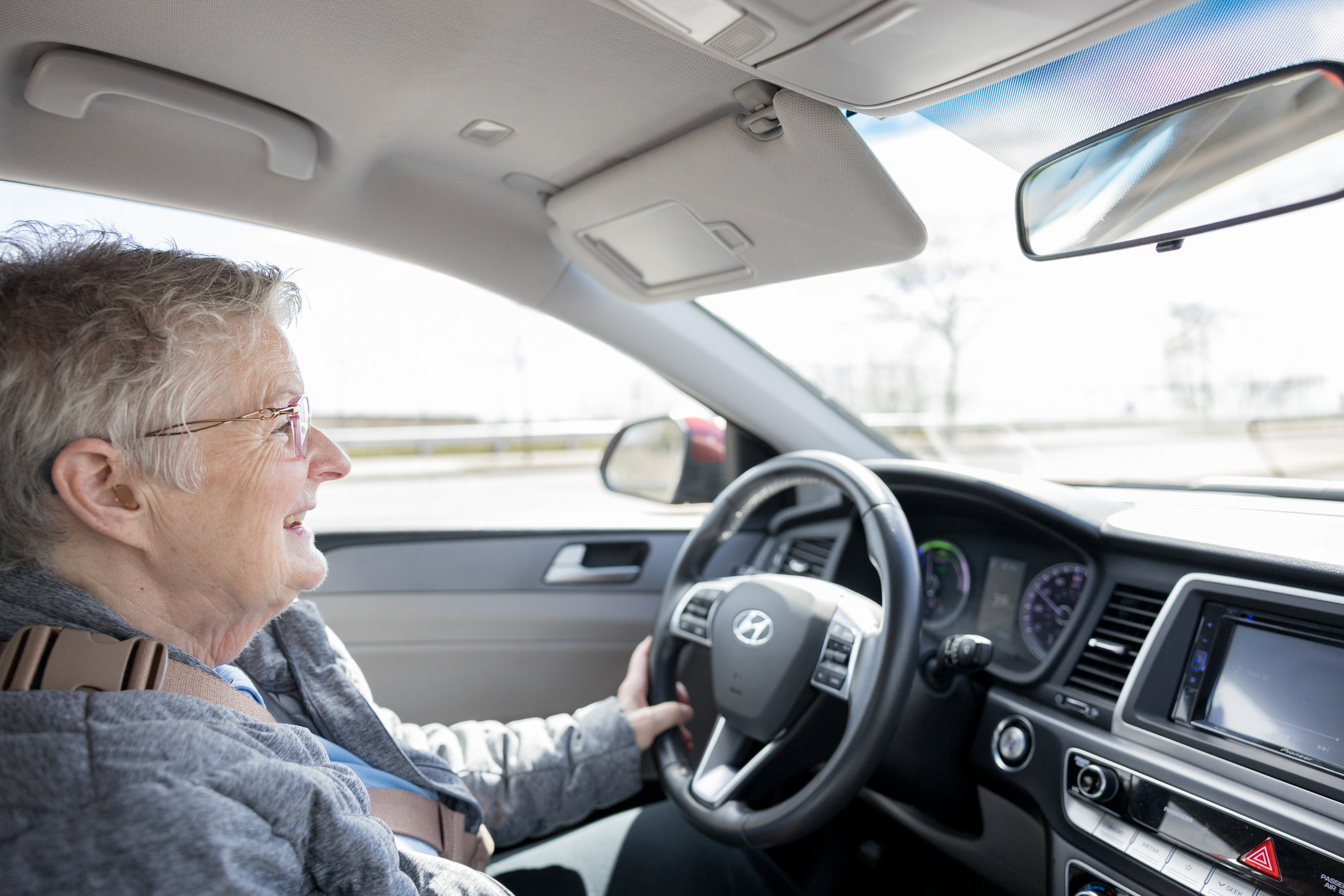 Meals on Wheels volunteer, Anne, driving her delivery route.
