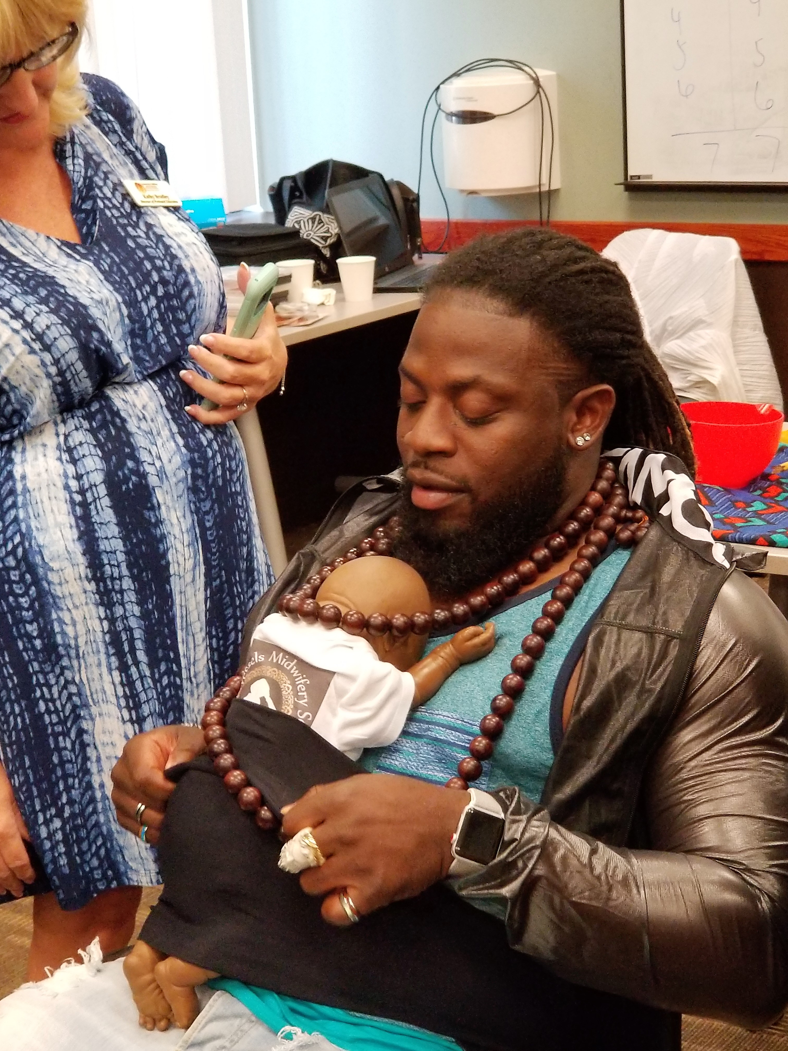 african american father training to be a doula, doula dad training