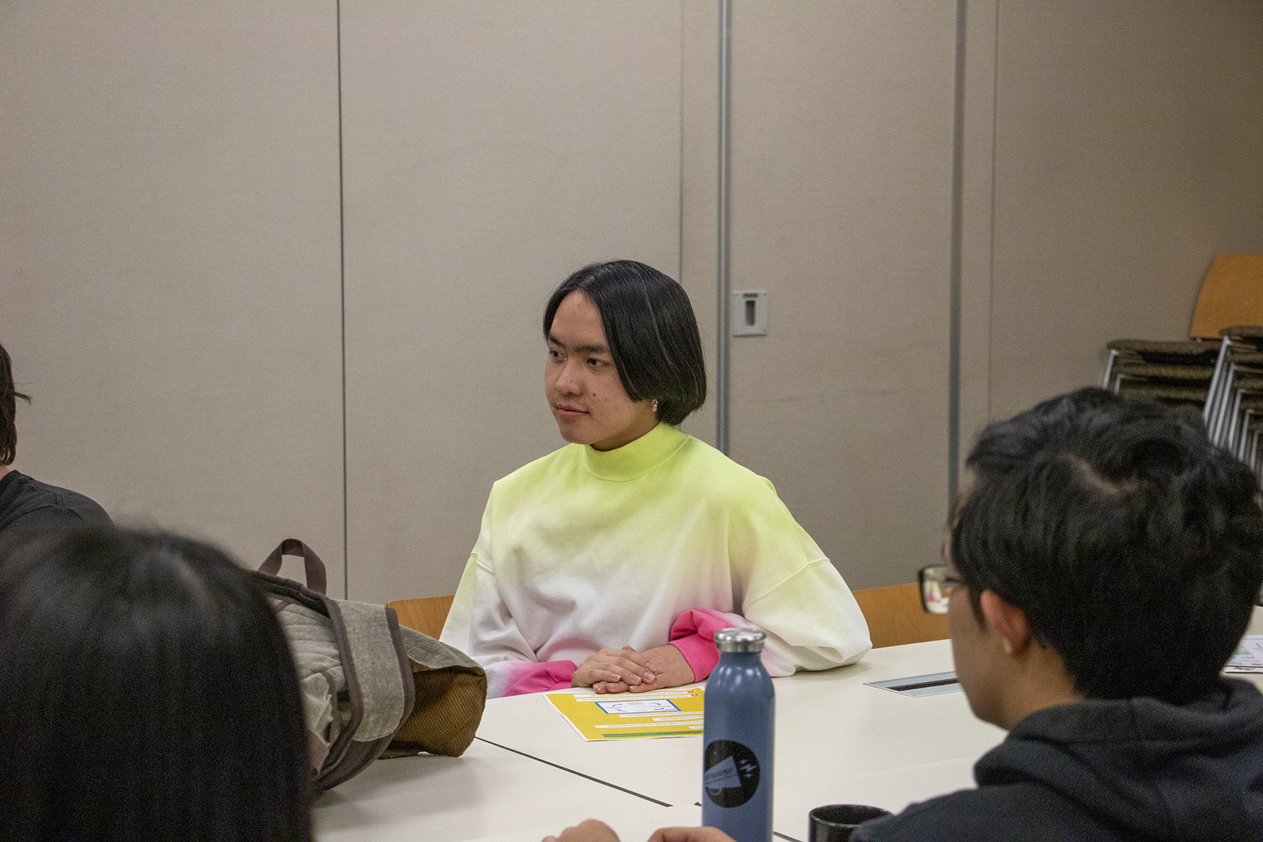 Yee Lor listens to other participants in the Youth Leadership Initiative