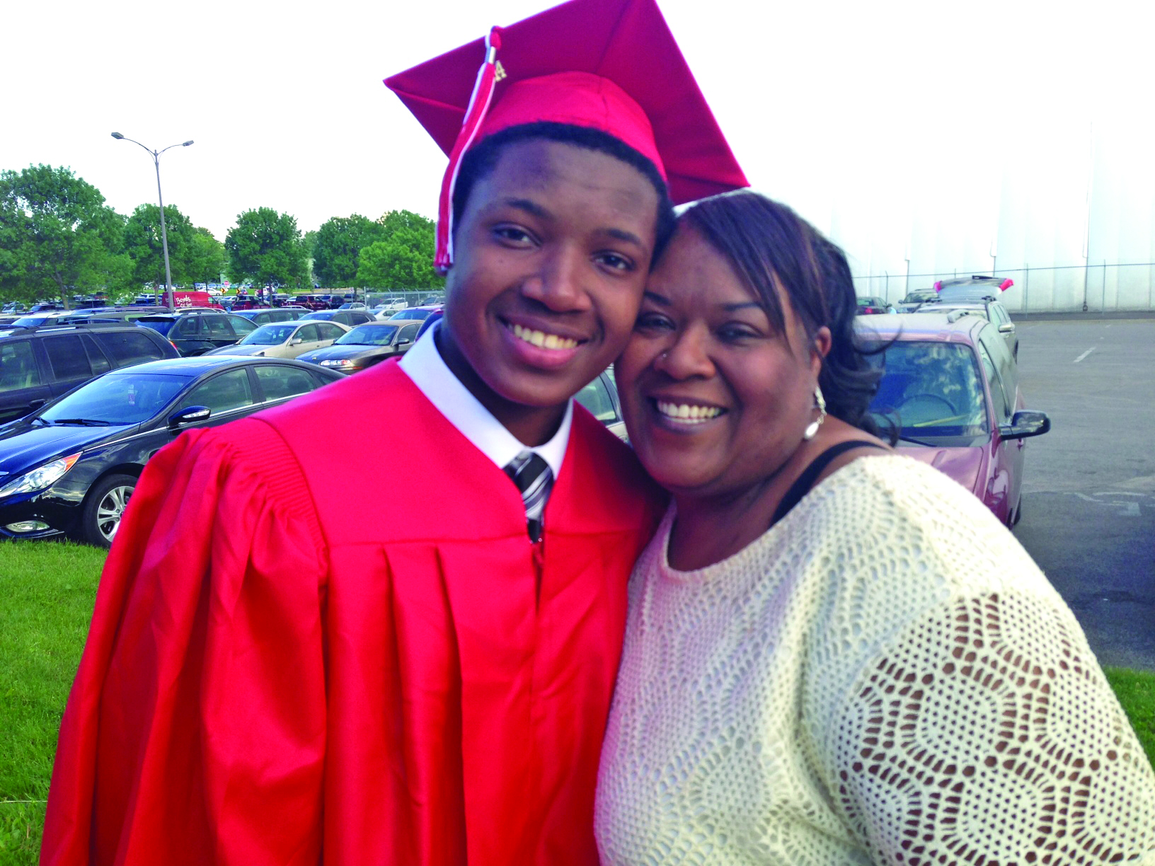 African American mother and son, high school graduate posing with mother, Kofi services for African American youth