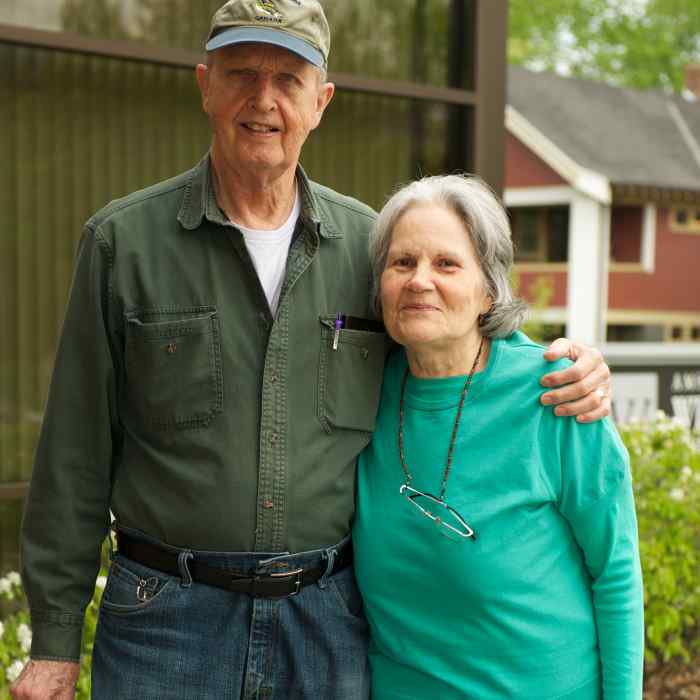 Older couple standing in front of Wilder's Community Center for Aging