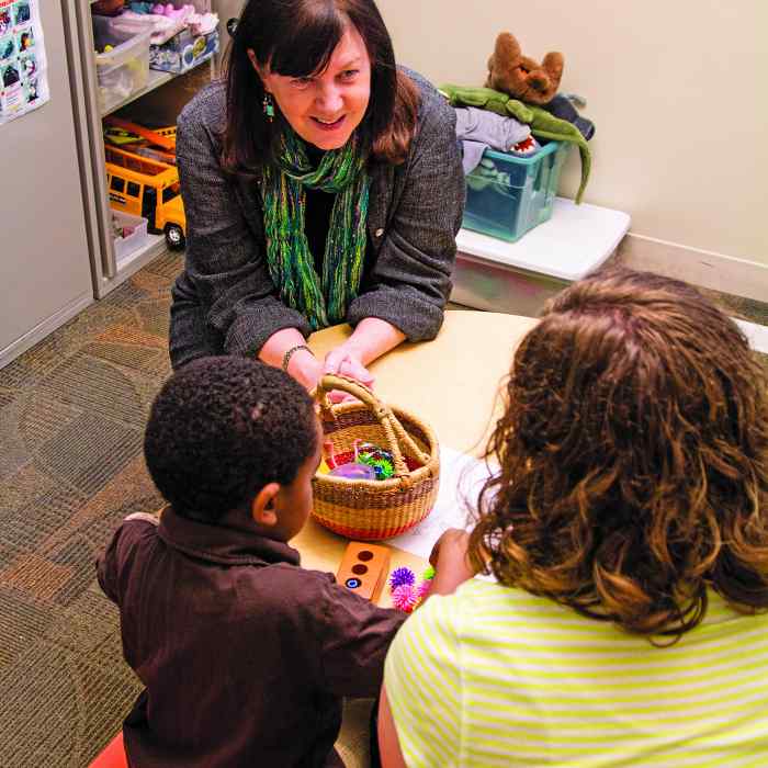 Child therapist in office