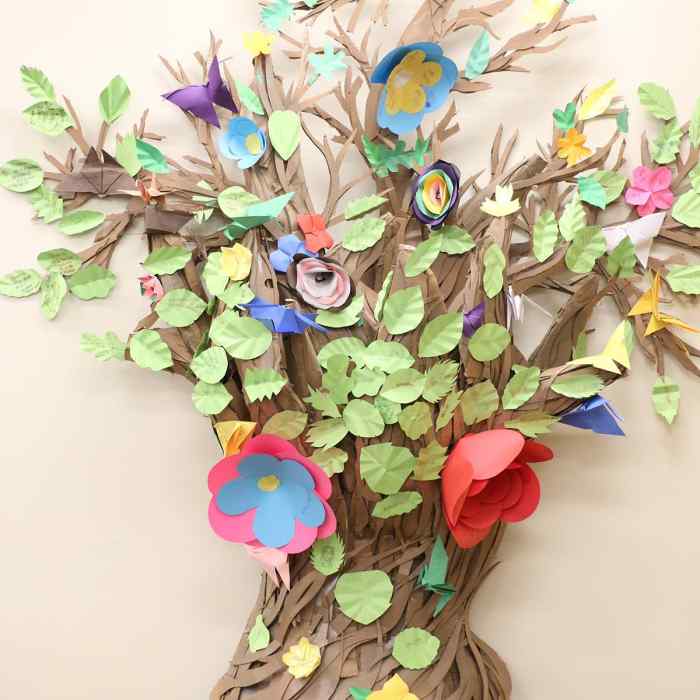 paper tree with paper flowers and leaves on it