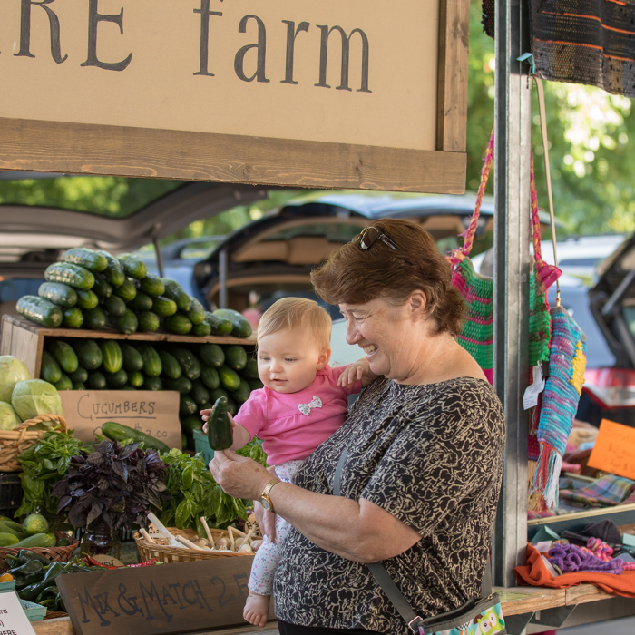 Woman and child shopping for healthy food at farmer's market