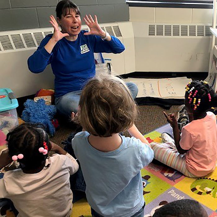 Sonya Wilson, volunteer Spanish teacher, teaching preschoolers at Wilder Child Development Center