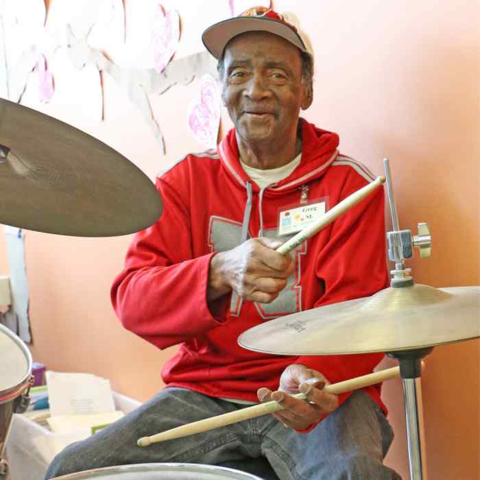 Adult Day Health participant Greg Mitchell pursues his passion for drumming at the Wilder Community Center for Aging