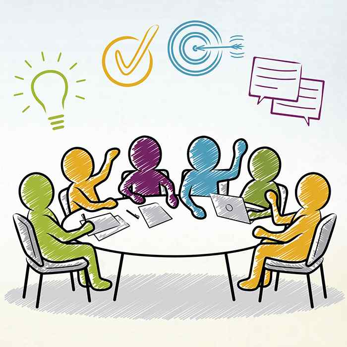 Six cartoon figures sit around a table with laptops and paper before them. Over their heads are a lightbulb, a check mark, a bulls eye, and talking bubbles.
