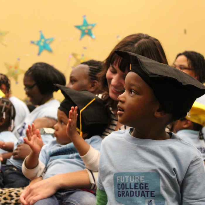 Parents and young children at graduation event