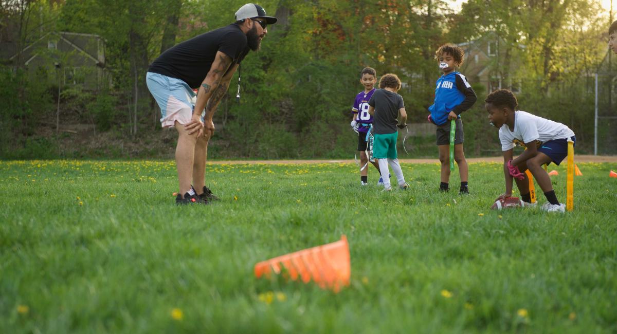 children playing football