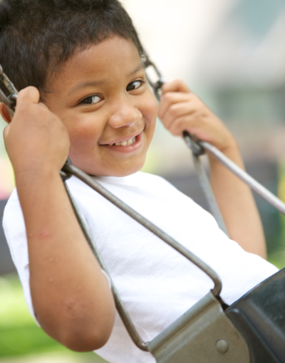 Child on swing in Saint Paul