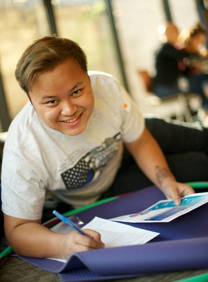 YLI participant working and smiling