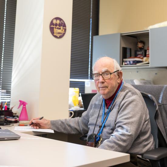 Dr. Kroll sitting in his office