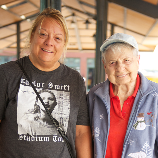 Caregiver with woman at farmers market