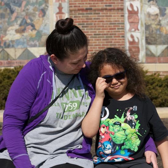 Mom and child sitting outside