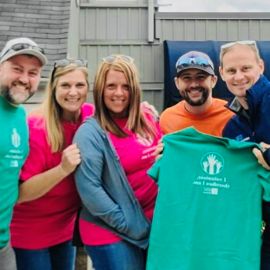 Five employees of Van Meter stand together before volunteering at Wilder Meals on Wheels