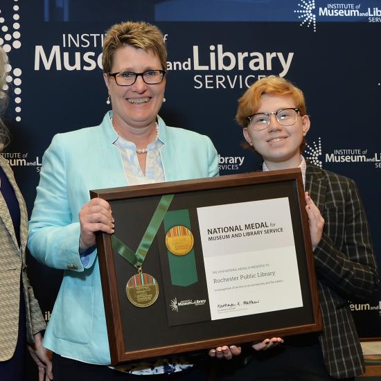 Rochester Public Library representatives receive the National Medal for Museum and Library Service.