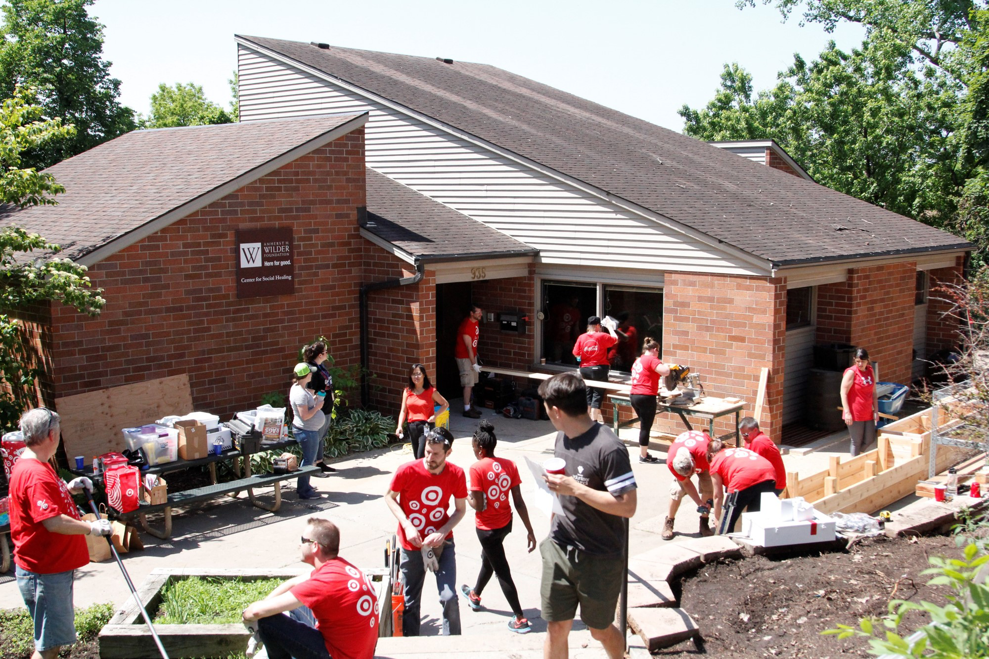 Volunteers doing work outside Wilder Center for Social Healing.