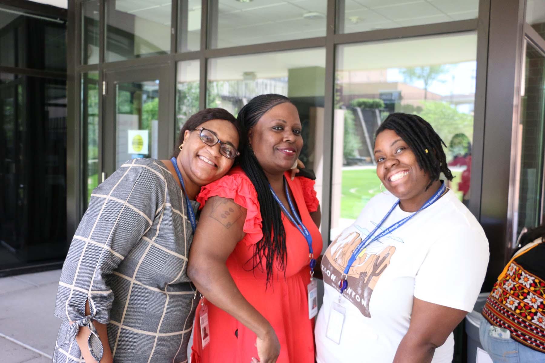 Three colleagues at the African American Babies Coalition and projects pose together during the Wilder staff appreciation picnic in July 2022