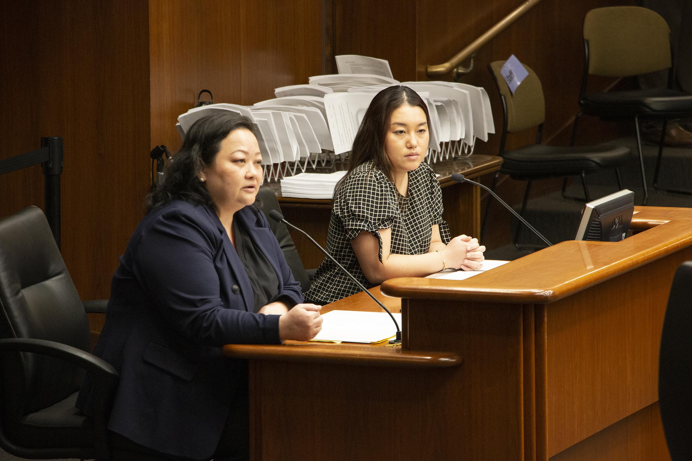two women sitting at a desk at the Minnesota Legislature