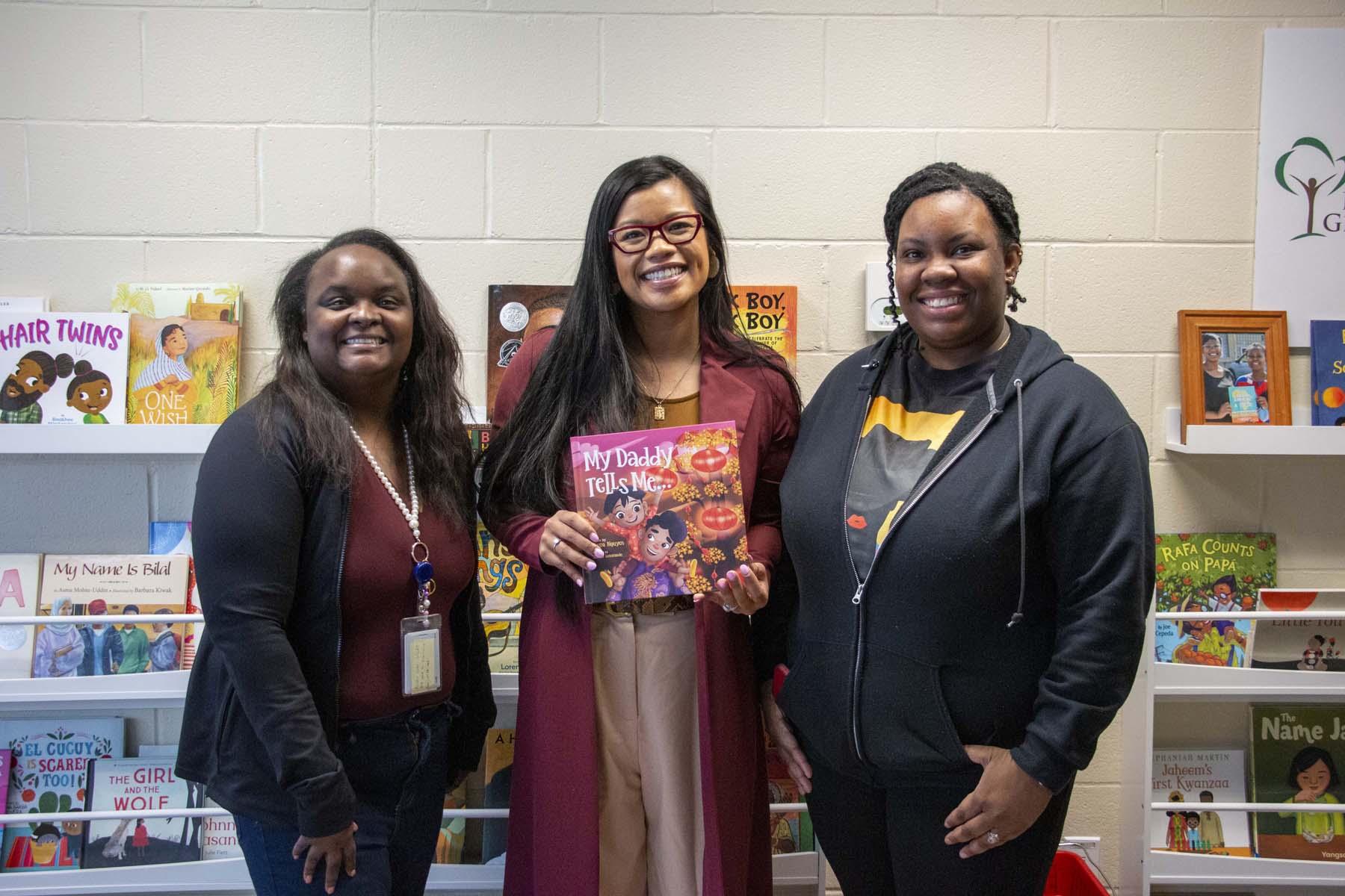 Three women pose together