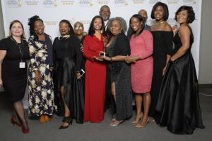 Brains Are Built group holding Emmy award
