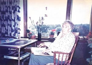 Woman sitting in a rocking chair in a nursing home in the 1980s
