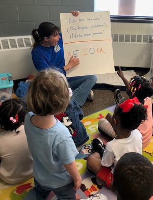 Volunteer Spanish teacher Sonya Wilson teaches students at Wilder Child Development Center.
