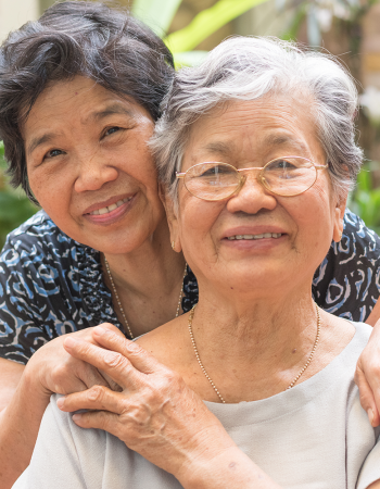 Mom and daughter hugging and smiling