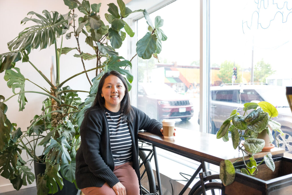 May enjoying a moment at Roots Café.