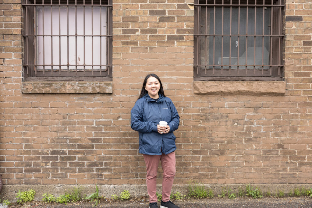 May stands in front of the building that once housed her family’s grocery store.