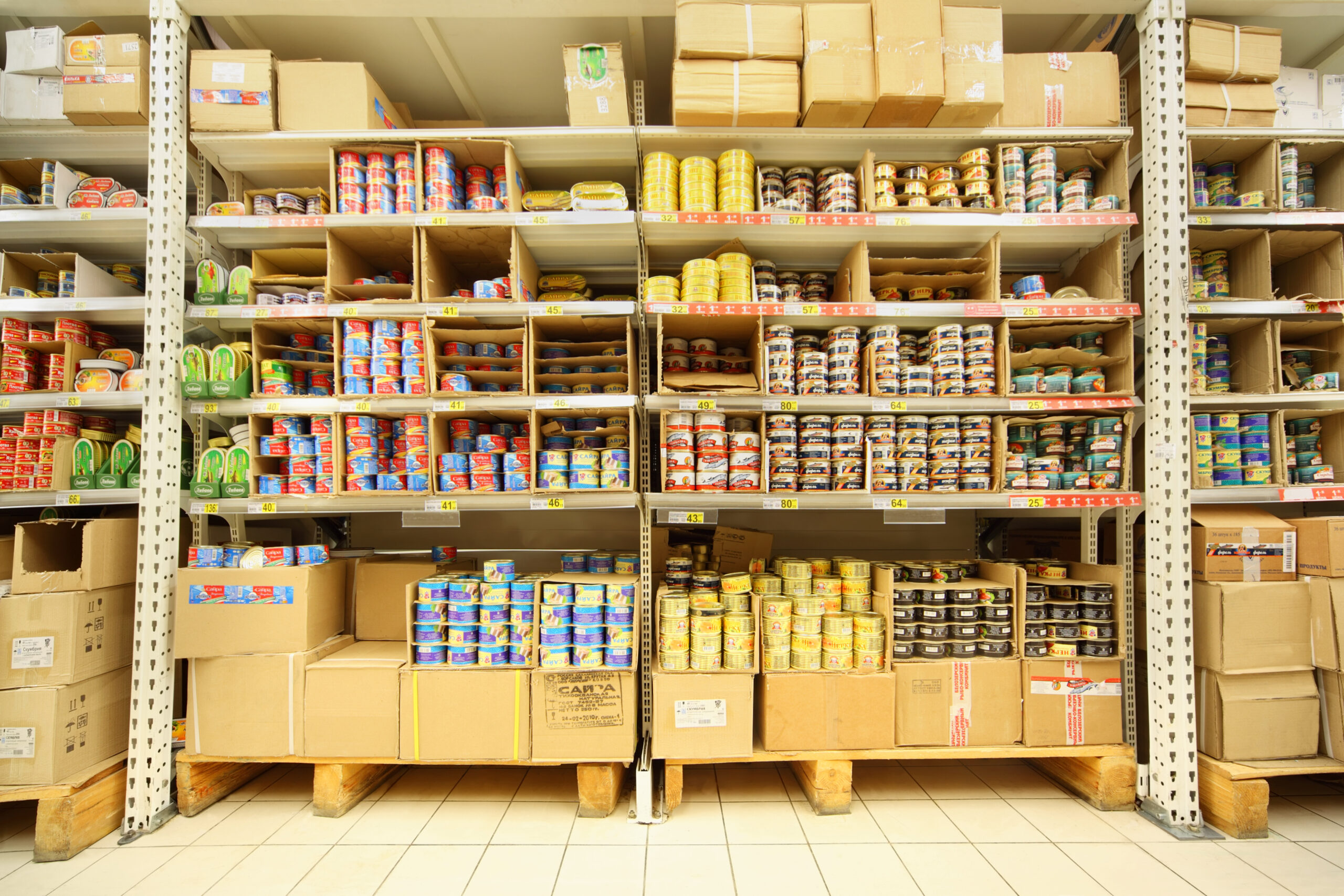 Shelves with canned fish in shop
