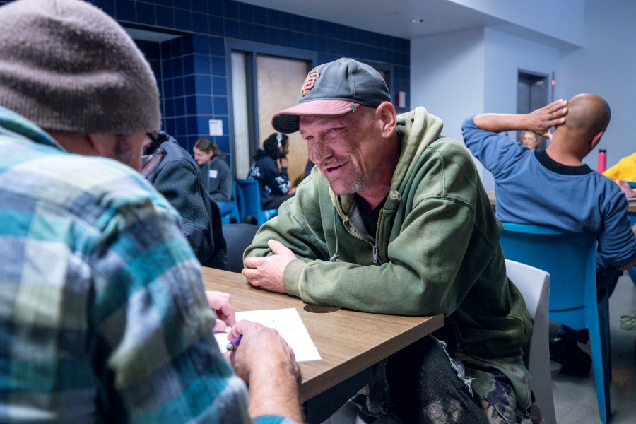 Two men talking at a table