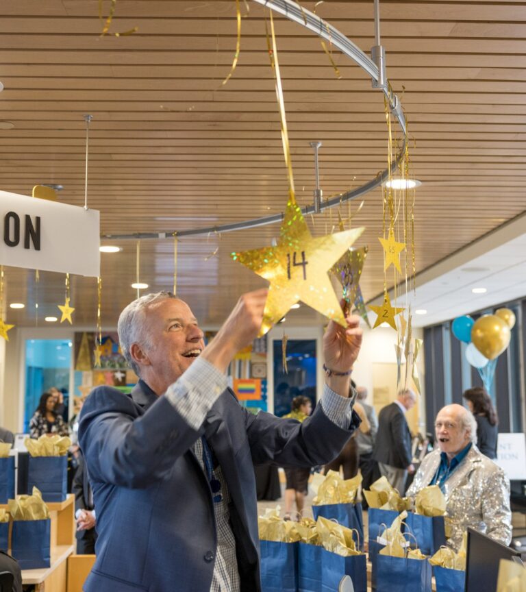 Volunteer decorating space with stars