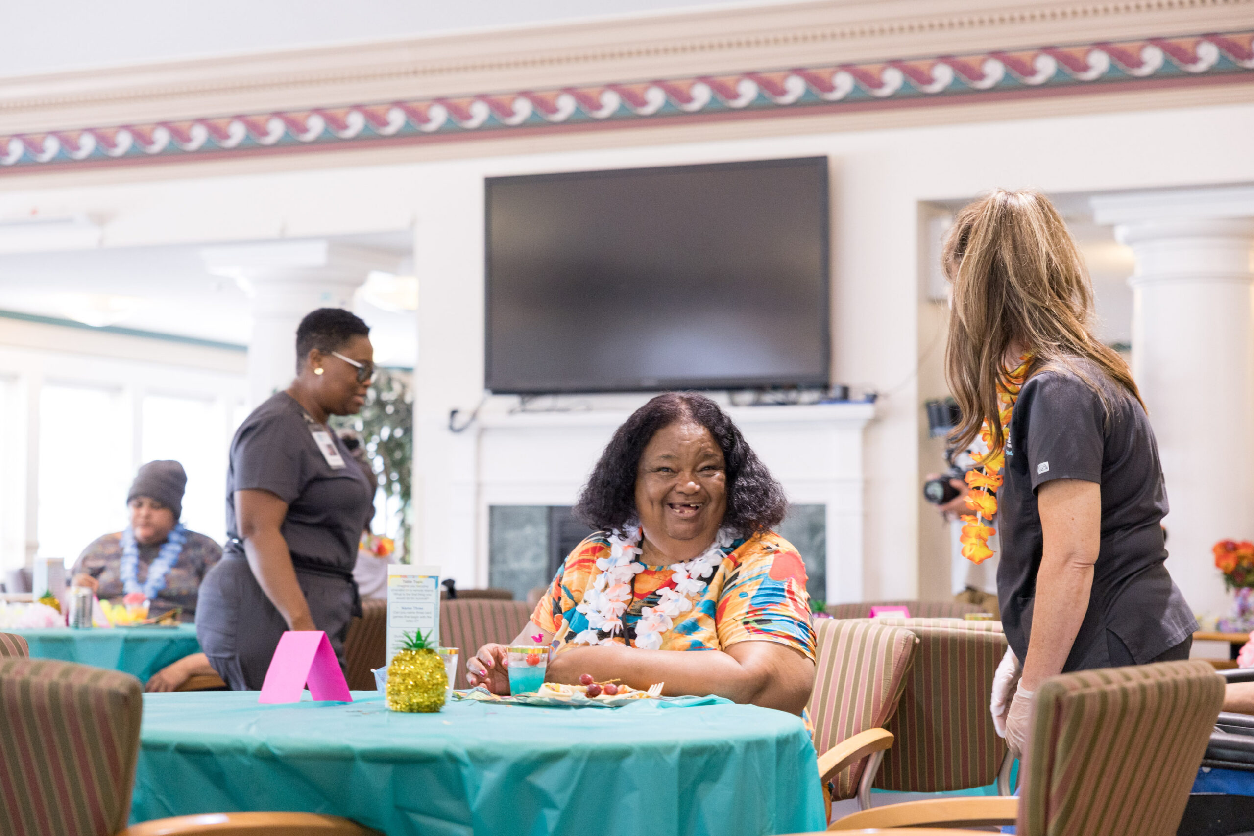 Wilder customized living resident enjoying a Hawaiian themed party.