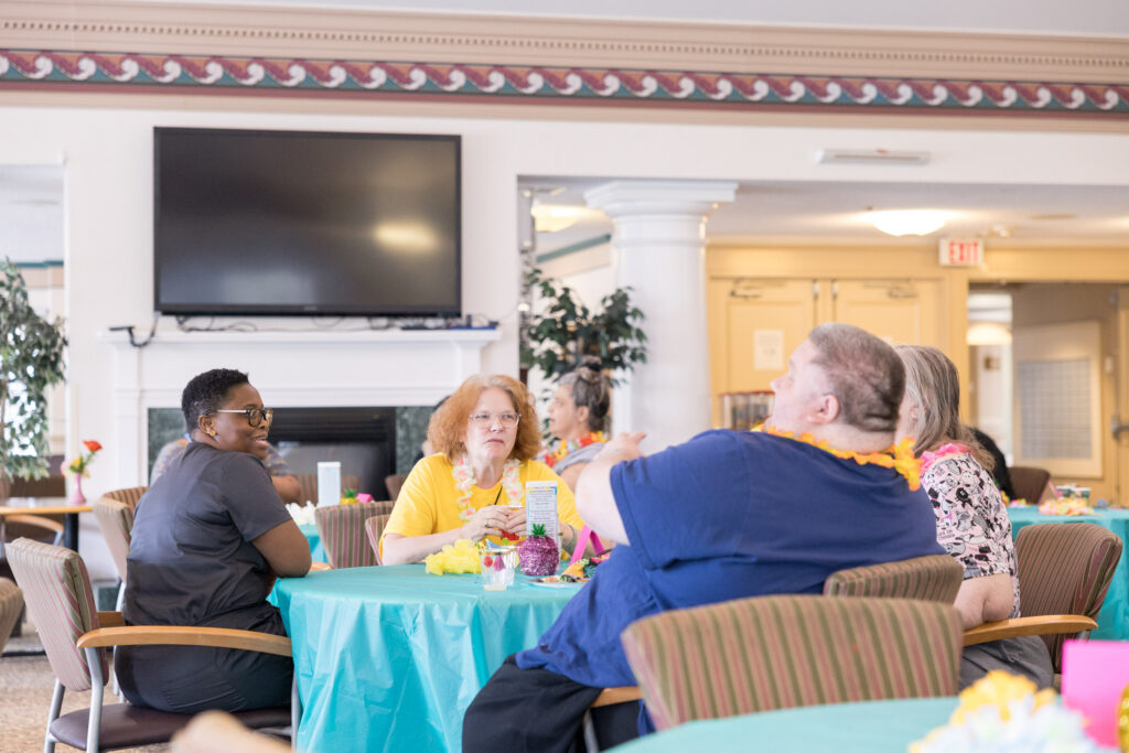 Residents at Wilder's customized living space enjoying each other's company.